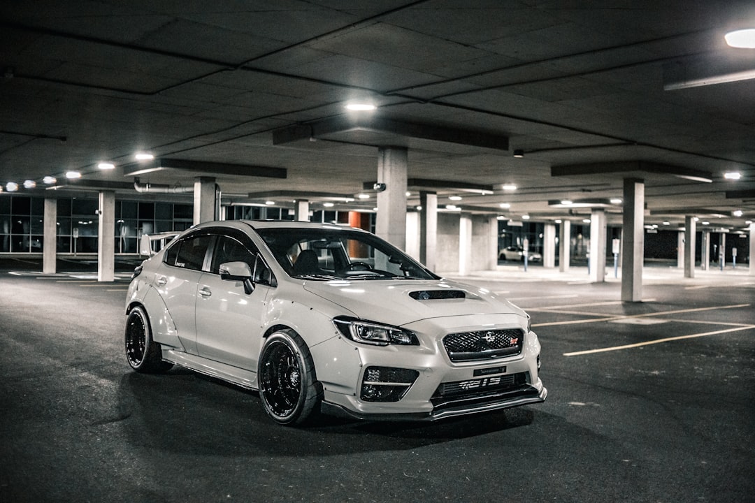 white bmw m 3 parked in parking lot