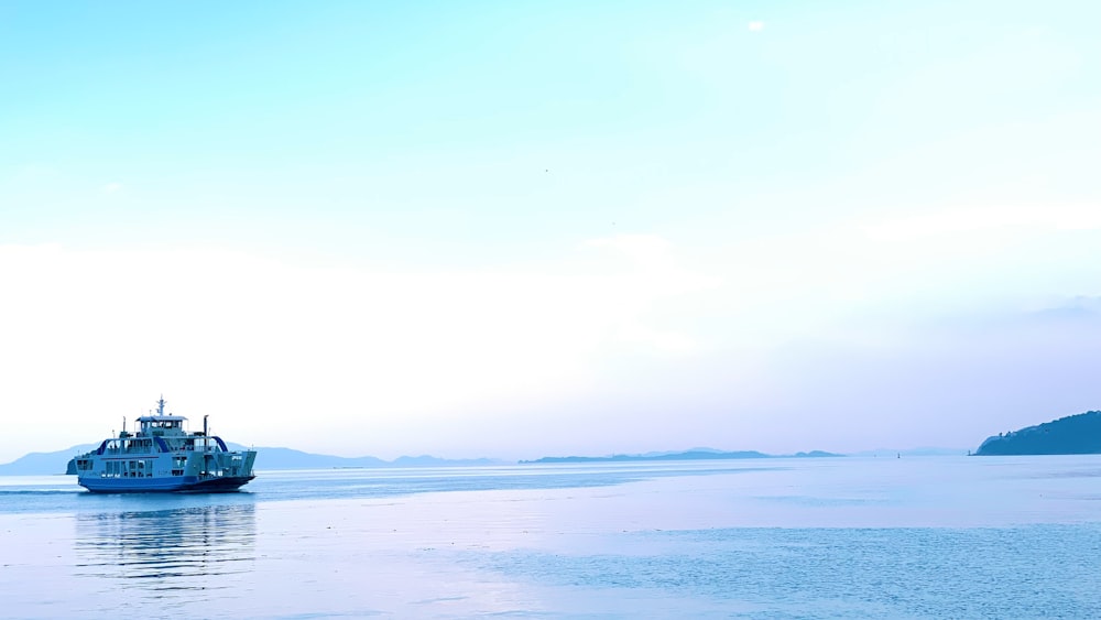 silhouette of person on body of water during sunset