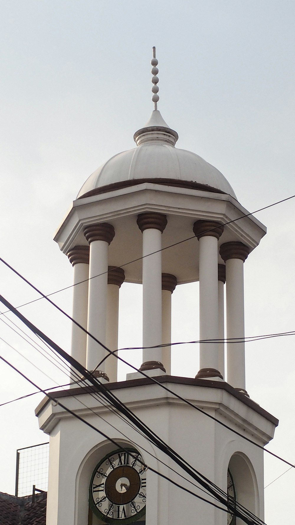 white concrete building under white sky during daytime