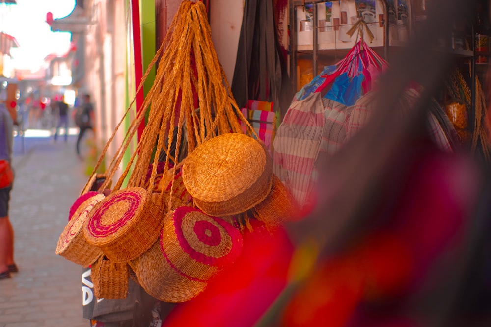 brown woven basket on red and yellow textile