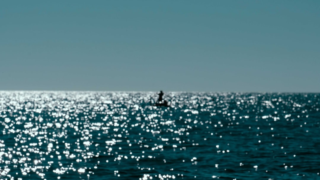 person surfing on sea during daytime