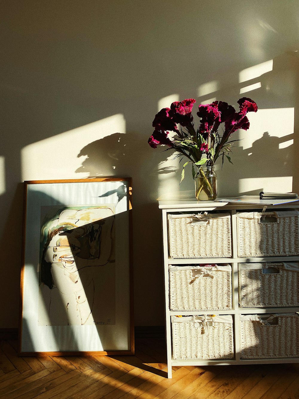 red roses on white wooden drawer