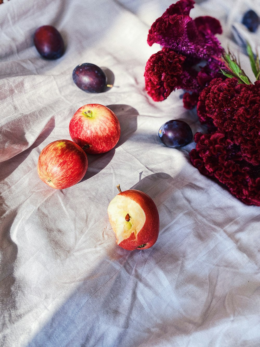 red fruits on white textile