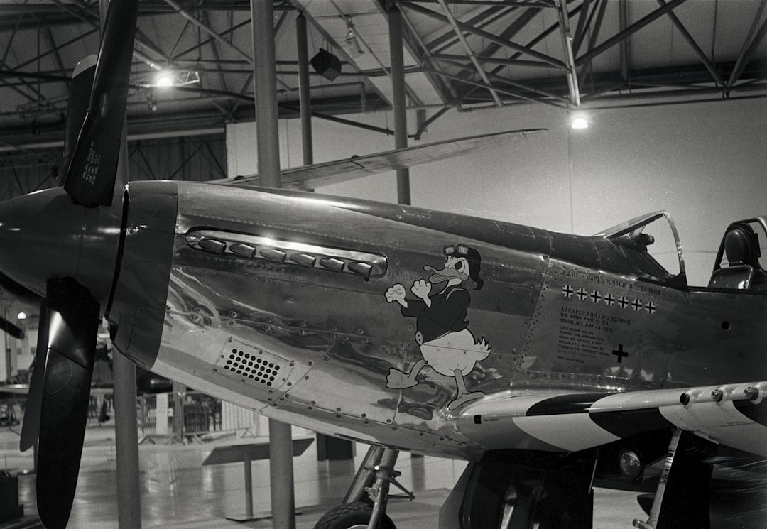 white and black airplane in a building,