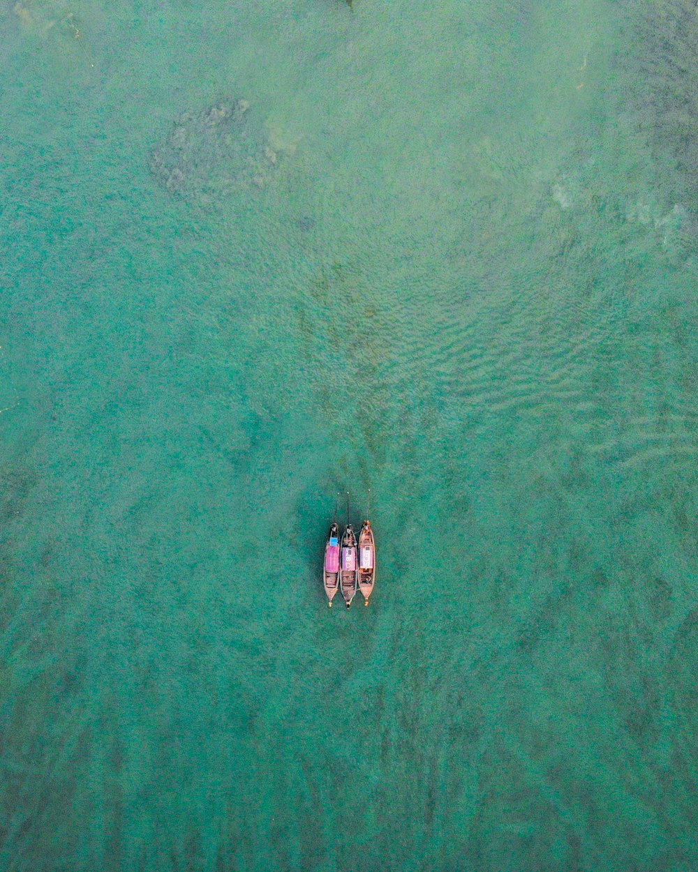 aerial view of boat on sea during daytime