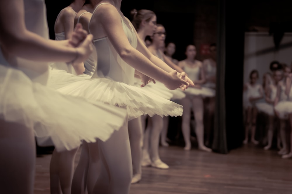 woman in white dress dancing on stage