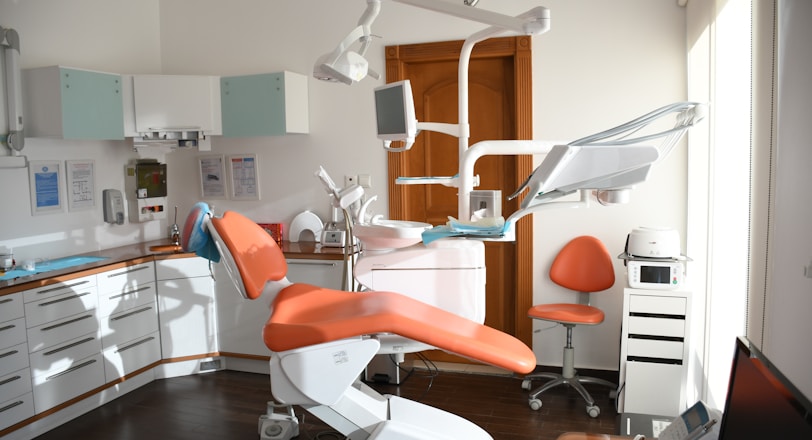 red and white massage chair dental office cleaning services