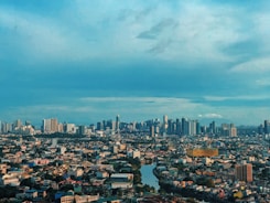 city skyline under blue sky during daytime