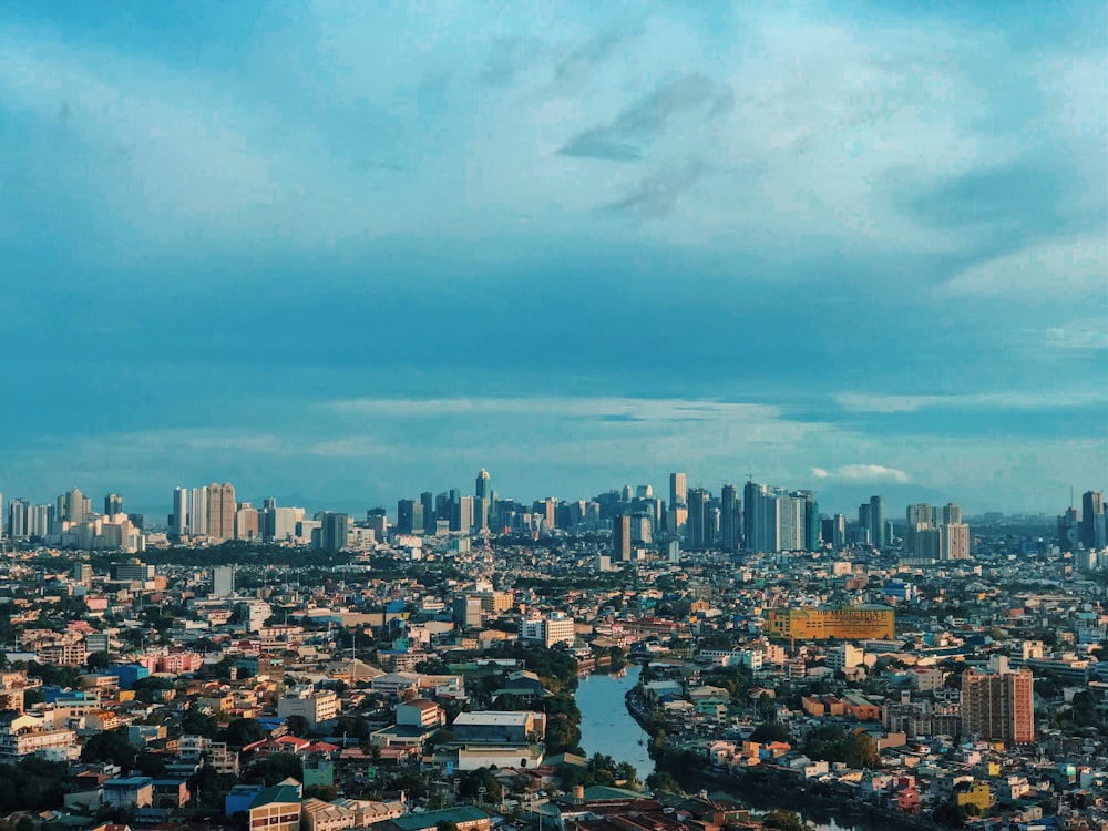 city skyline under blue sky during daytime