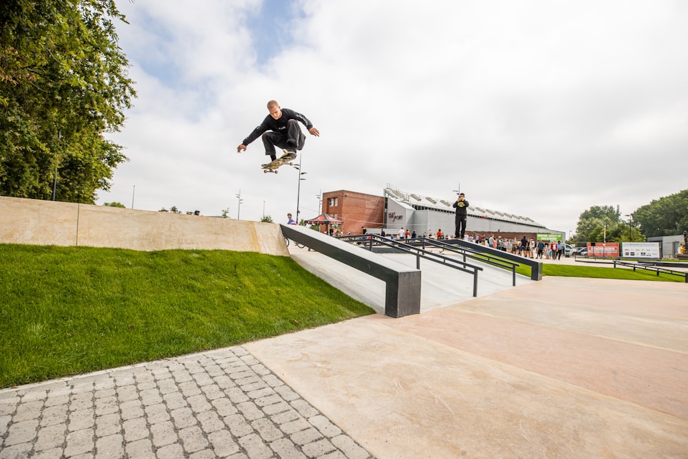 a man flying through the air while riding a skateboard