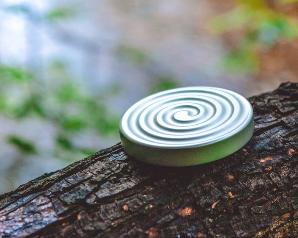 green round ornament on brown wood