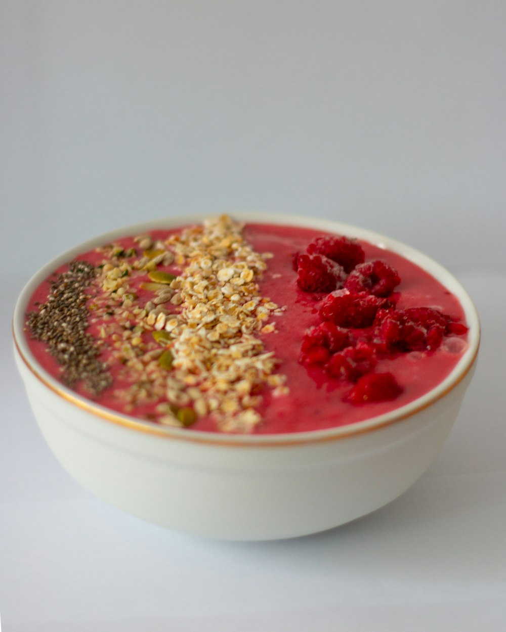 white ceramic bowl with red and brown food