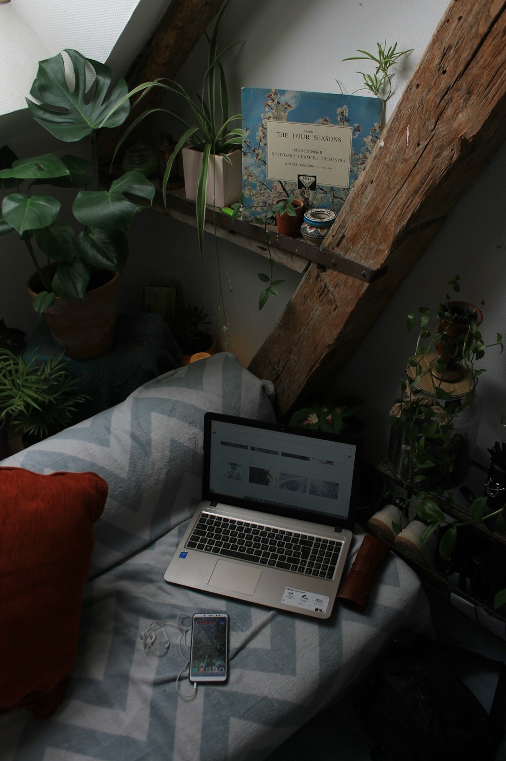 macbook pro on white bed