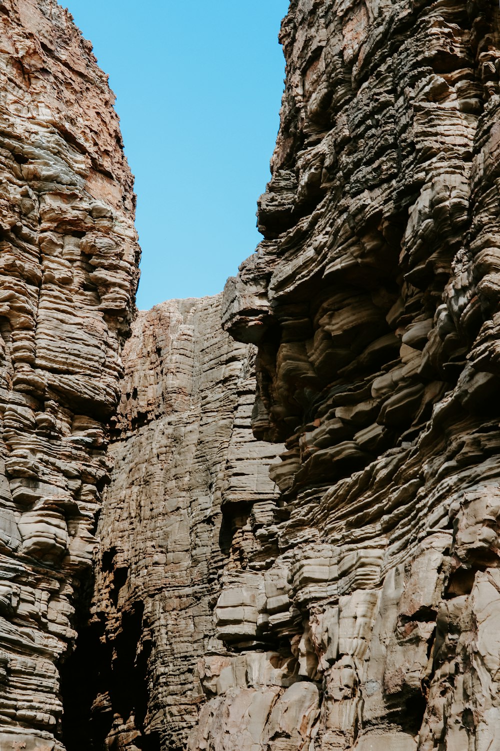 brown rocky mountain under blue sky during daytime