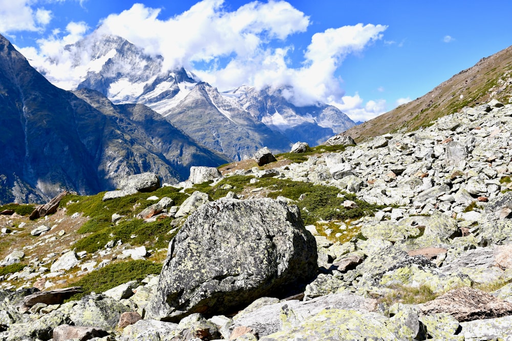 gray rocky mountain under white cloudy sky during daytime