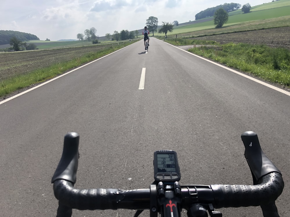 black smartphone on black road