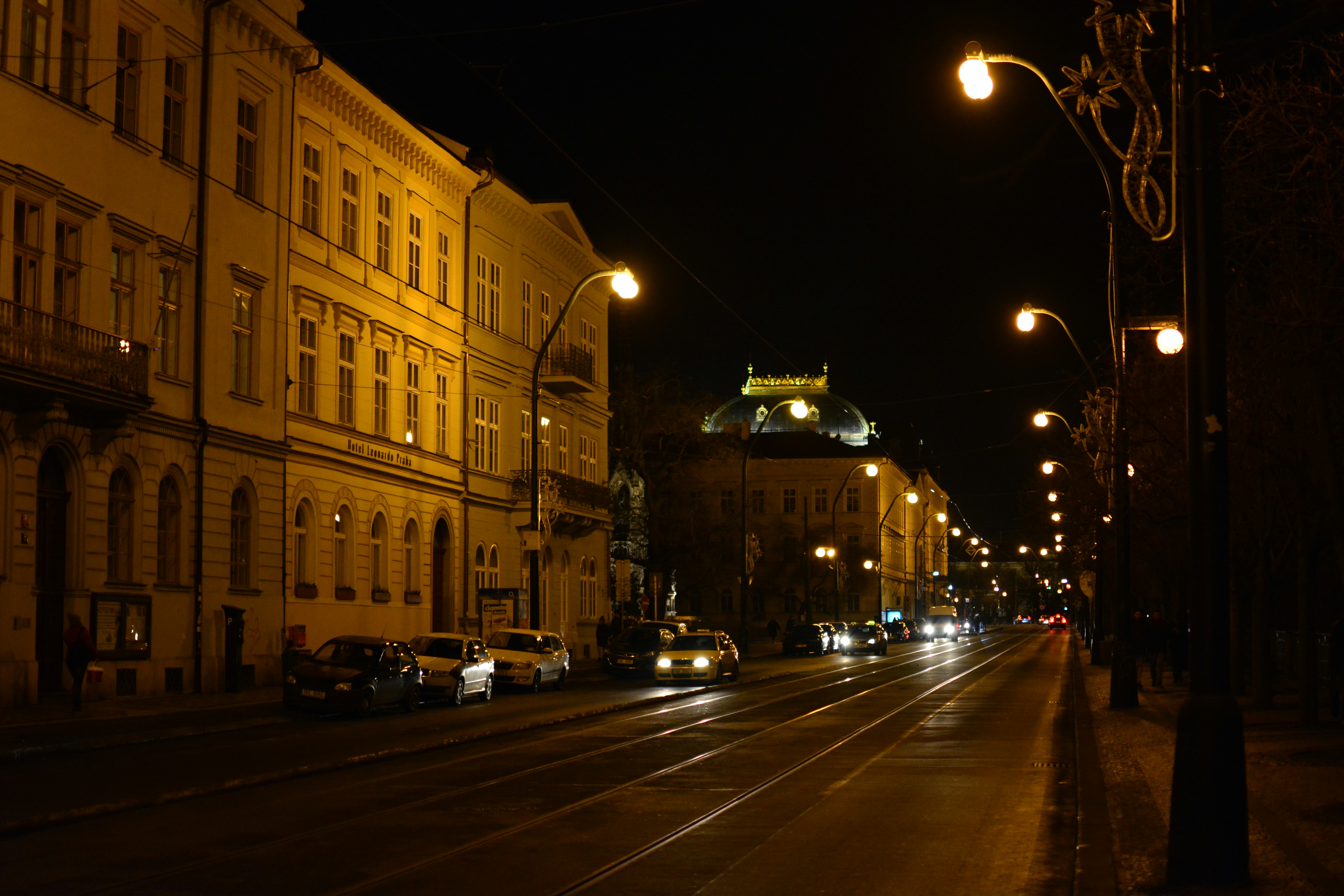 cars parked in front of building during night time, 