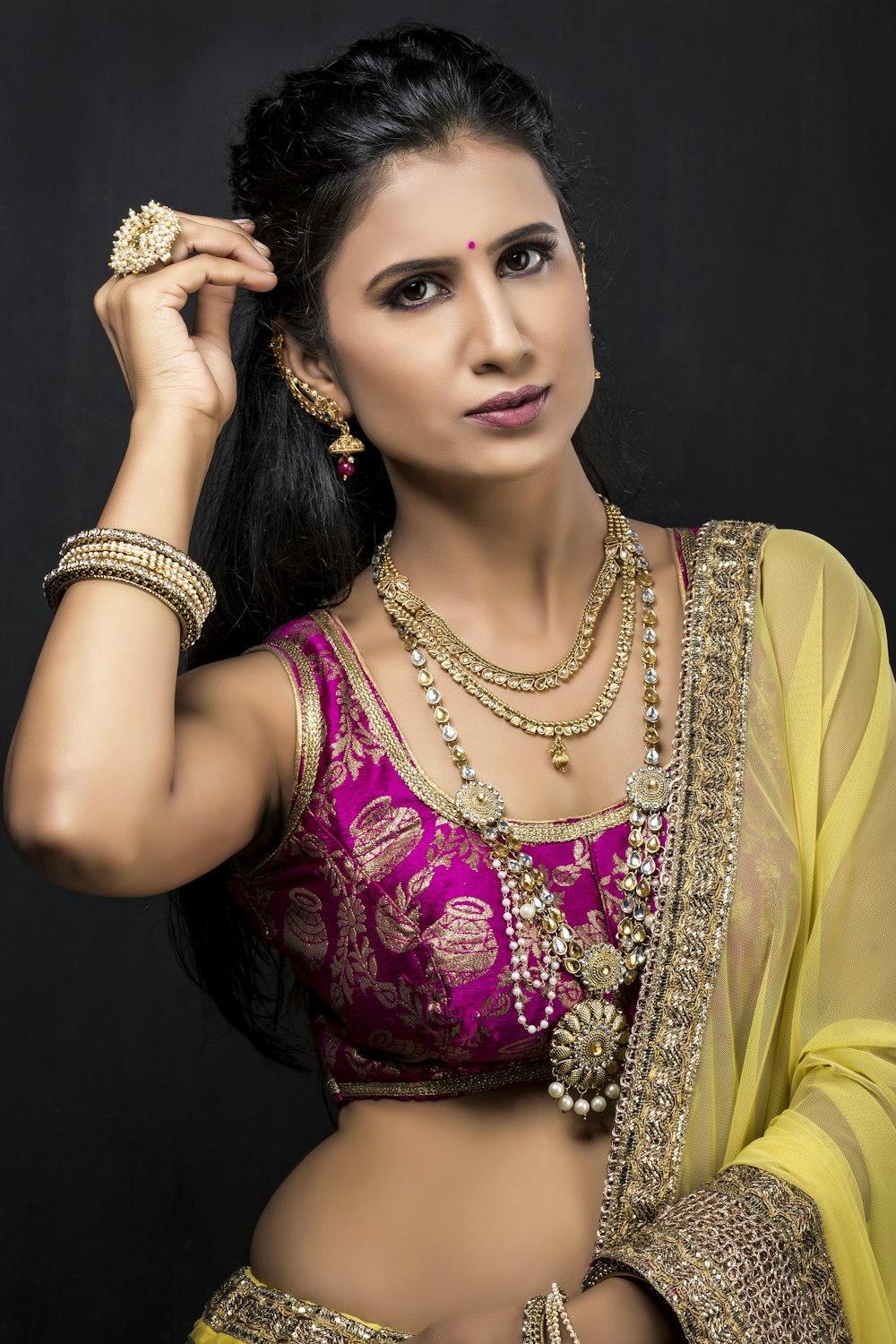 woman in yellow and red sari