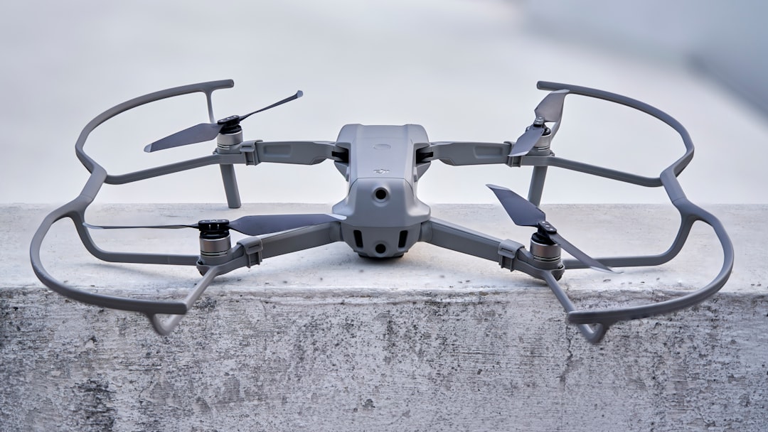 gray and black drone on gray concrete floor