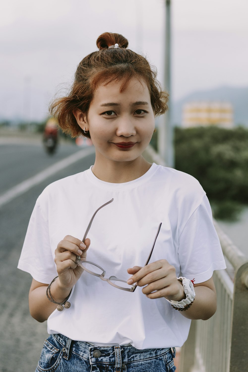 girl in white crew neck t-shirt holding silver spoon