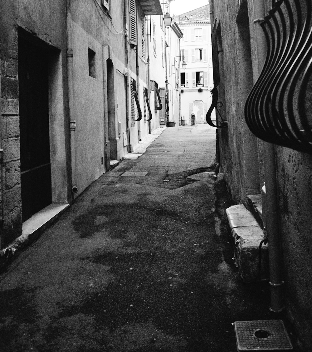 grayscale photo of alley with no people