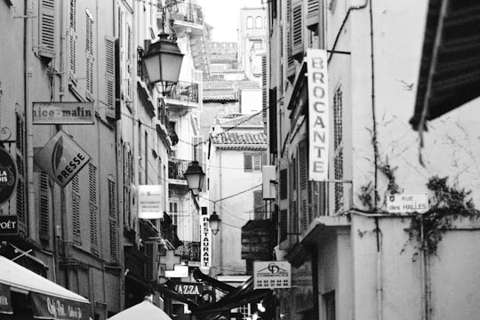 grayscale photo of city street in Cannes France
