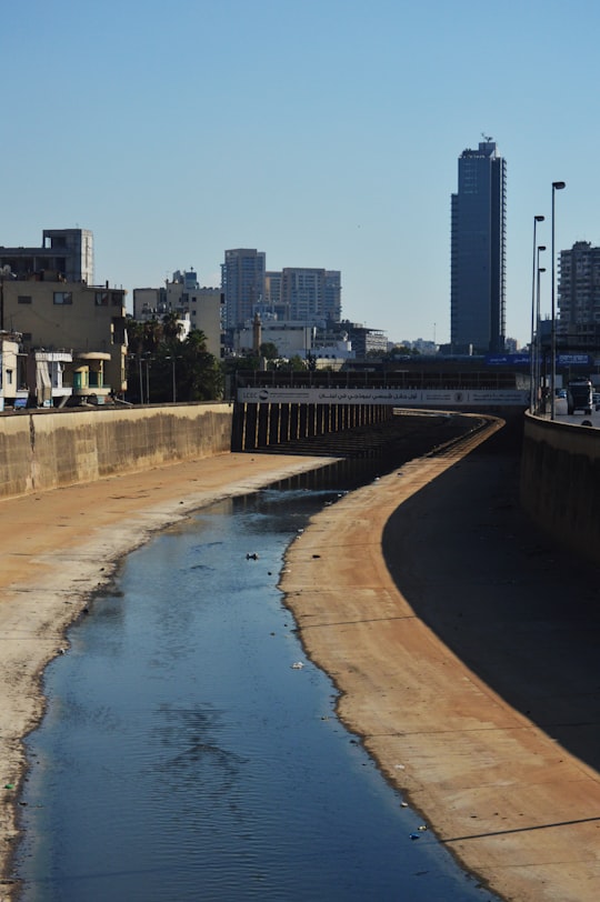 people walking on beach near high rise buildings during daytime in Bourj Hammoud Lebanon