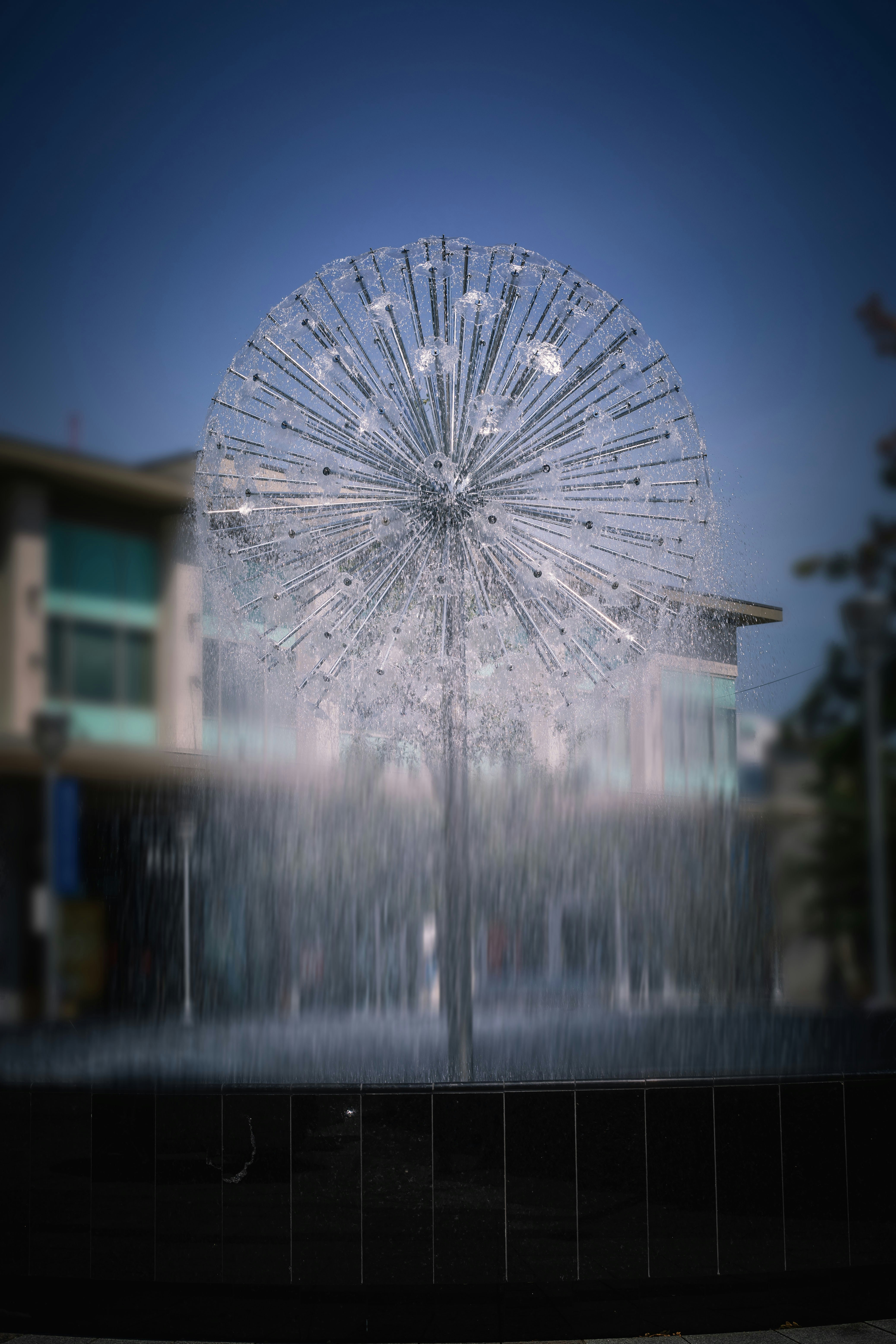 white round water fountain during night time