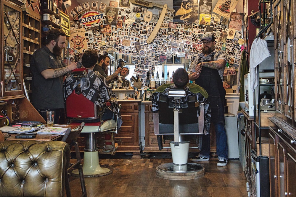 people sitting on barbers chair