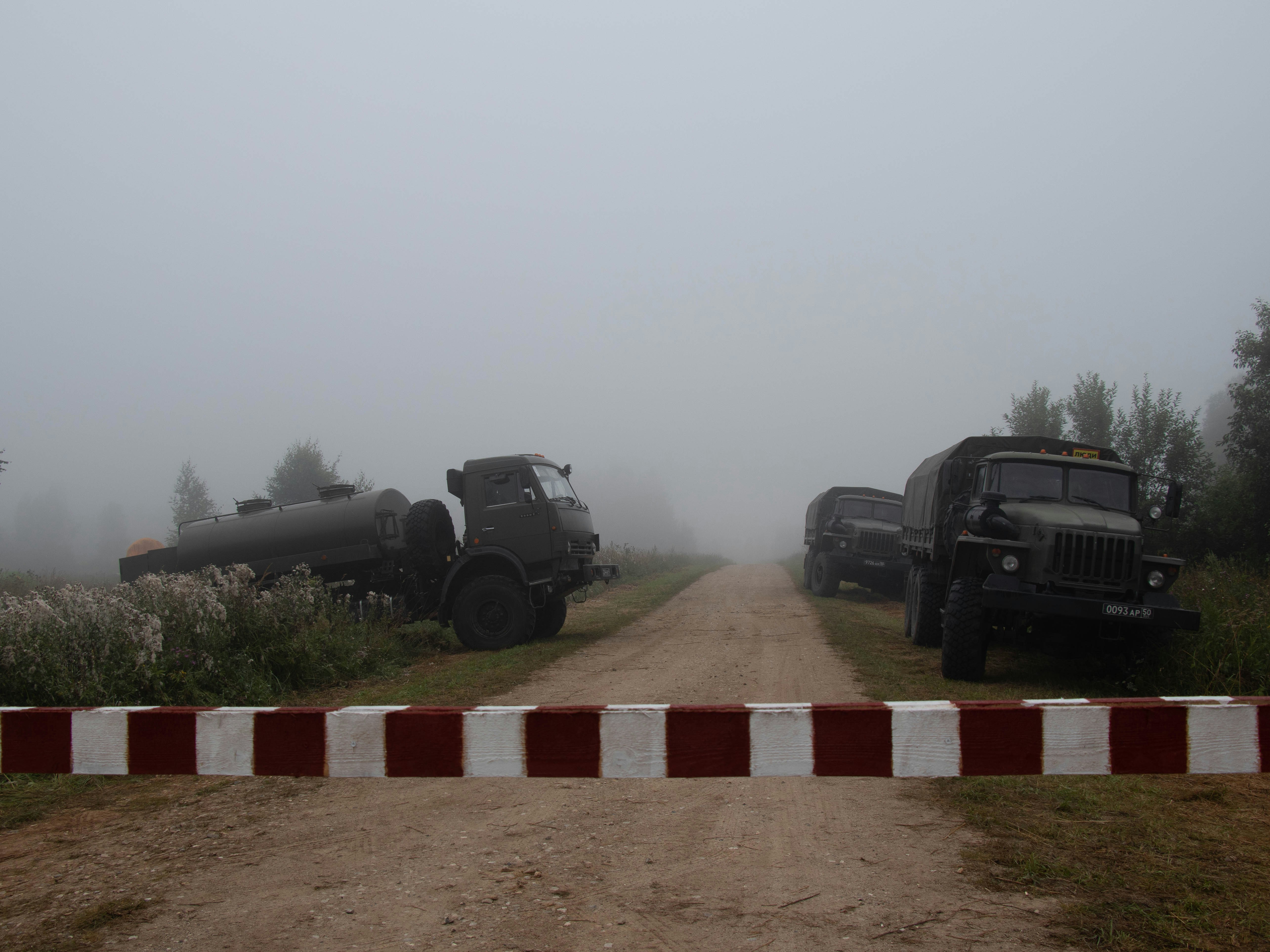 black suv on brown and white brick pathway during daytime