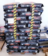 Stacks of sealed raw material bags ready for shipment.