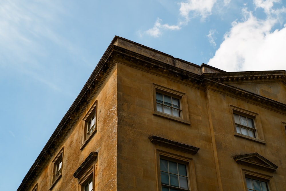 brown concrete building under blue sky during daytime