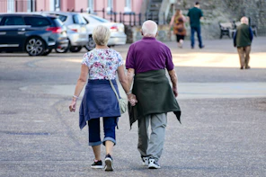 man and woman walking on the street during daytime
