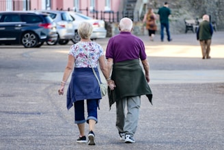 man and woman walking on the street during daytime