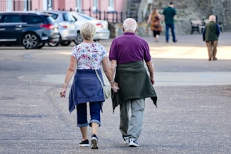 man and woman walking on the street during daytime