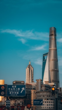 A professional team discussing trade strategies with a backdrop of Guangzhou city skyline.