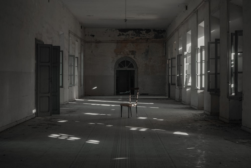 person in white shirt sitting on chair