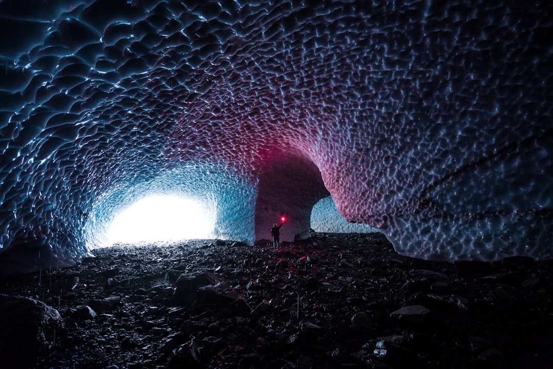 white sand with water during daytime, Big 4 Ice Caves