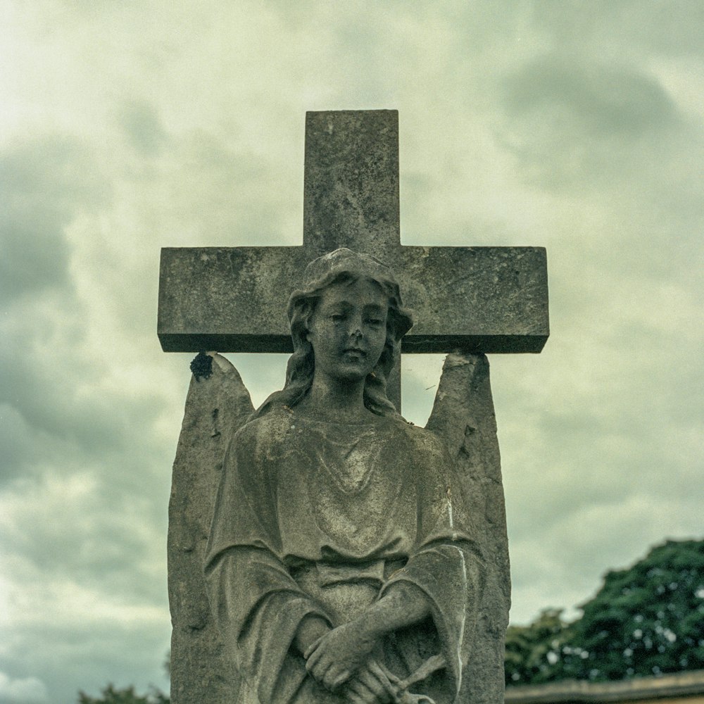 gray concrete statue of a woman