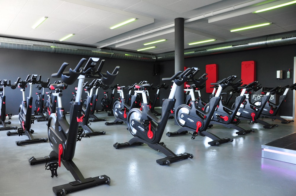 black and red stationary bikes
