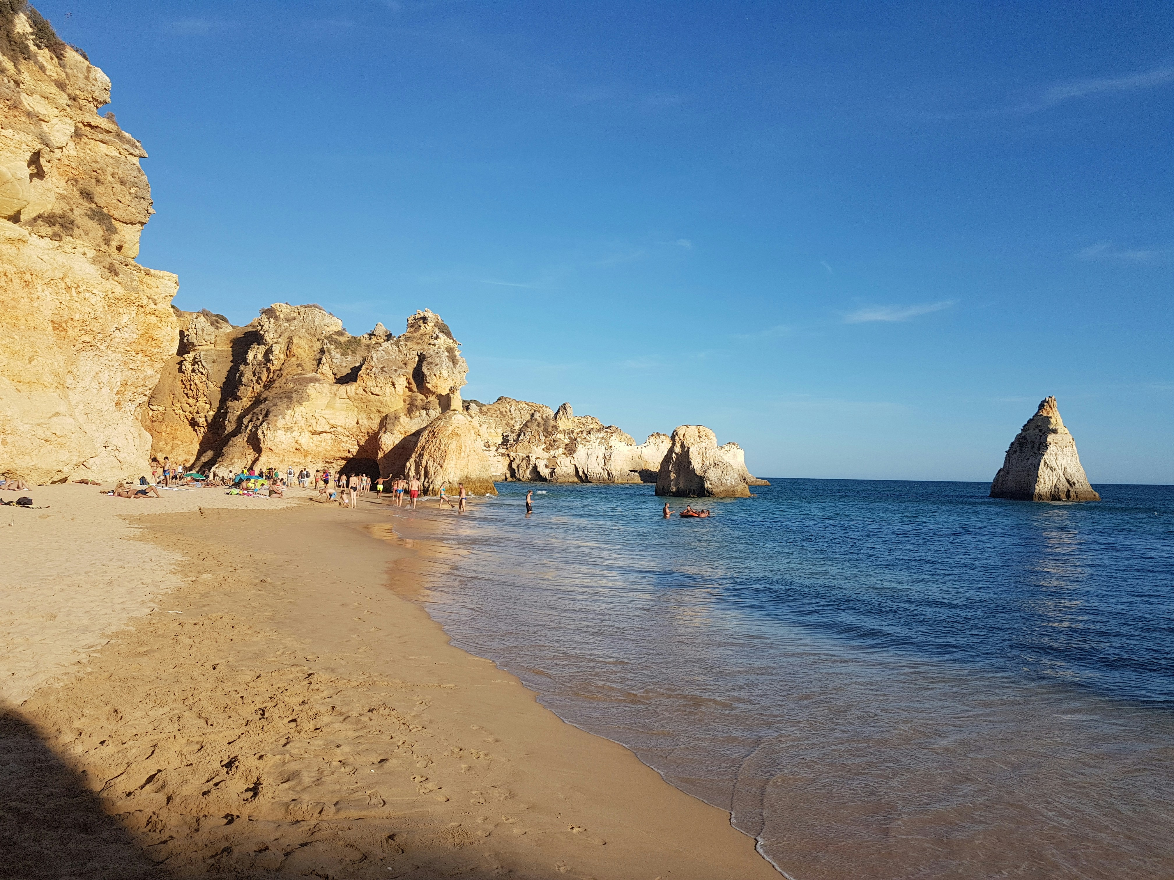 brown rock formation on sea shore during daytime, 