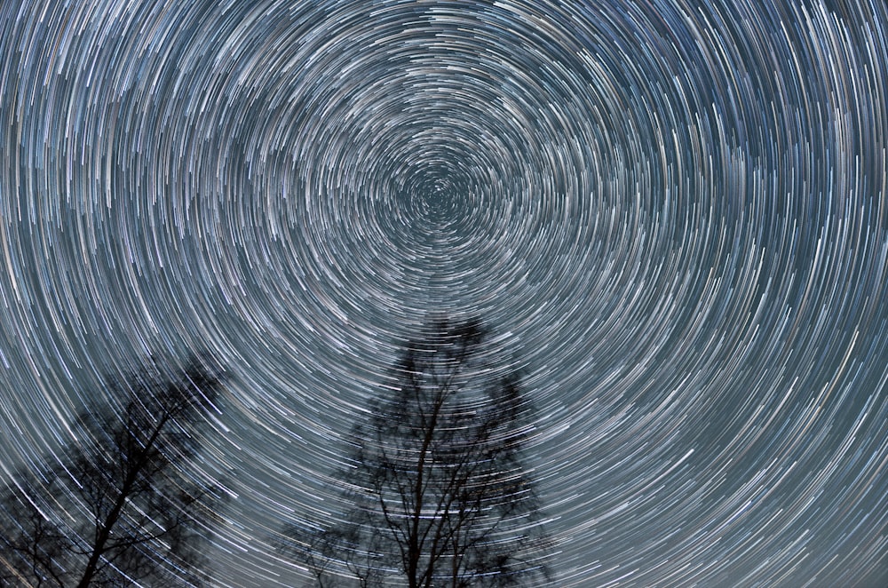 time lapse photography of stars in the sky during night time