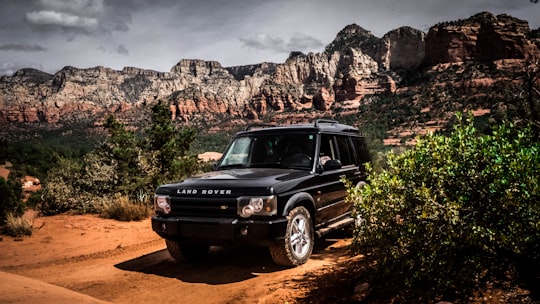 black mercedes benz g class suv on brown dirt road during daytime in Arizona United States