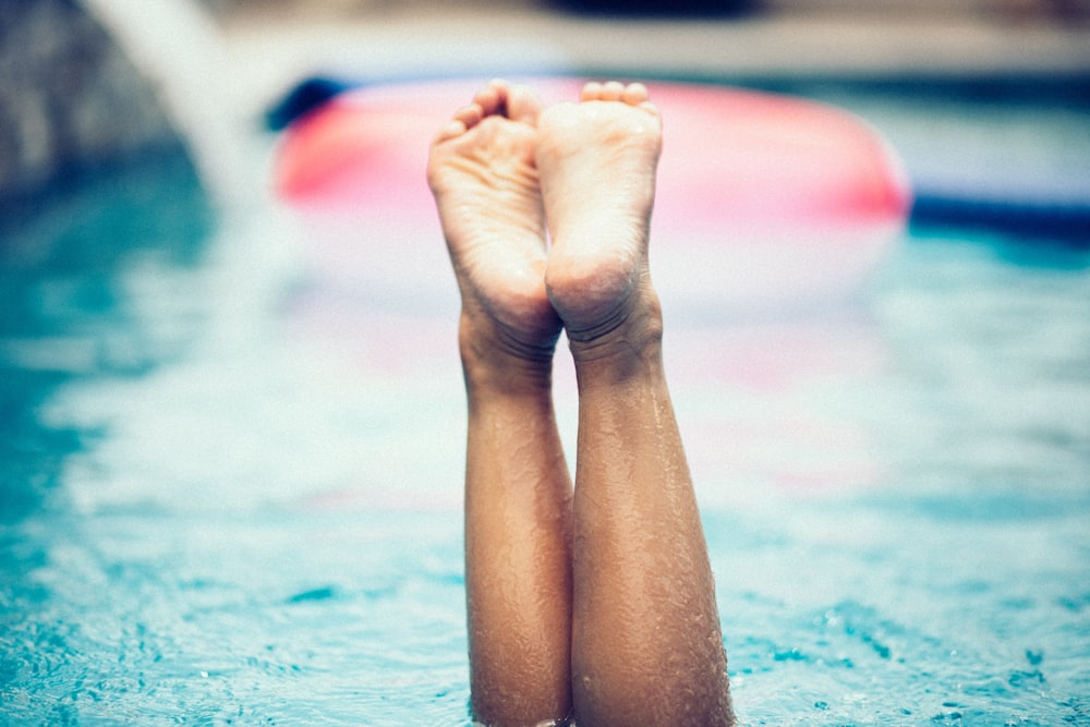 persons feet on water