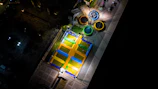 A sprawling trampoline park with families bouncing and laughing together.