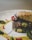 A close-up of a beautifully plated dish with fresh ingredients.