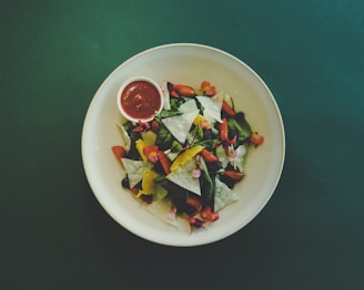 vegetable salad on white ceramic bowl