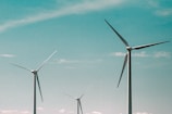 wind turbines under blue sky during daytime