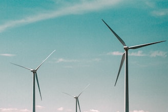 wind turbines under blue sky during daytime
