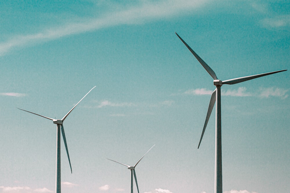 wind turbines under blue sky during daytime